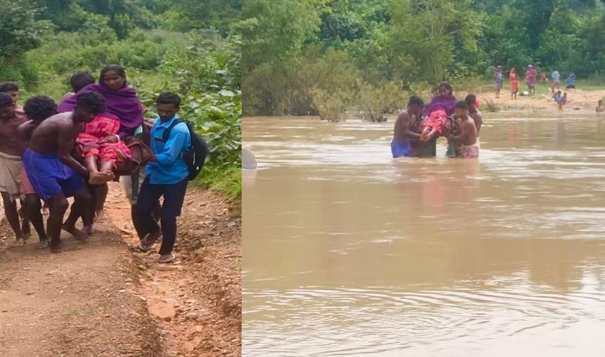 Khabar East:Villagers-carried-a-pregnant-woman-writhing-in-labor-pain-across-the-river-to-the-hospital